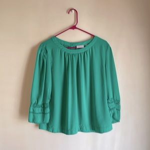 Look great in green, so many cute details-crochet on sleeves, button back & more